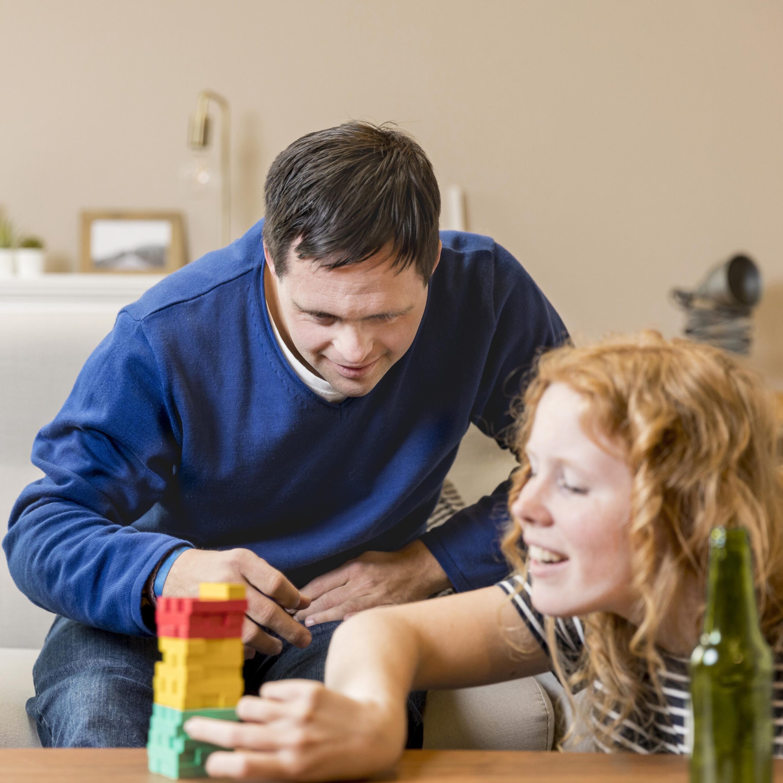 man-woman-playing-games-home-while-having-beer
