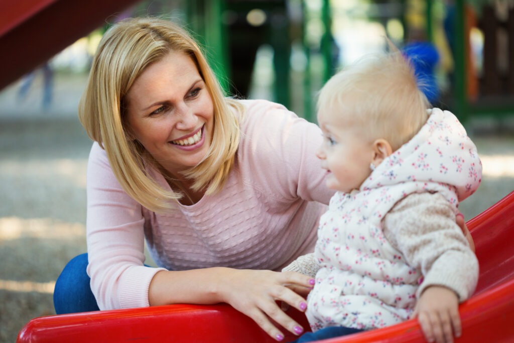 happy-young-mother-with-her-baby-boy-playing