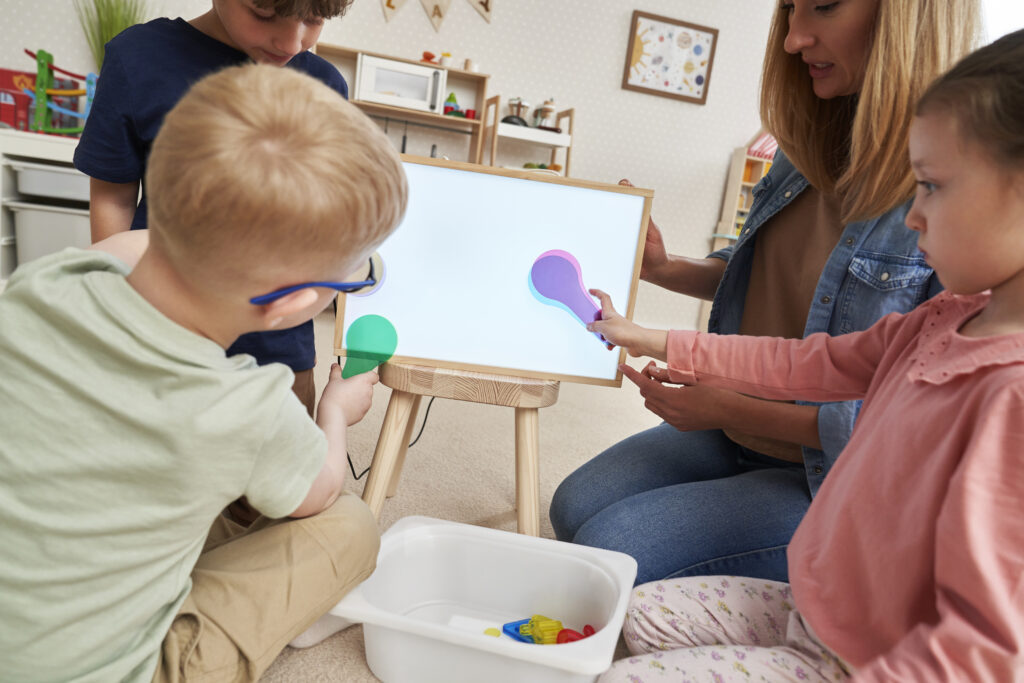 teacher-and-children-doing-sensory-exercises